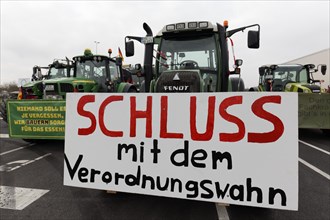 Stop the regulation madness, sign against bureaucracy on a tractor, farmers' protests,