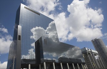 Clouds reflected by surface of Nationale Nederlanden office building in Rotterdam, Netherlands