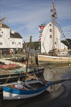 Historic boats on the River Deben by the historic Tide Mill, Woodbridge, Suffolk, England, United