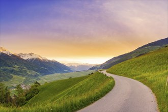 Mountain panorama of a small road in the South Tyrolean Alps, sunset, evening mood, path, Goldrain,
