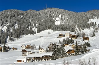 The mountain village of Corvara, Kurfar, at the foot of the Col Alto high plateau in winter, Alta