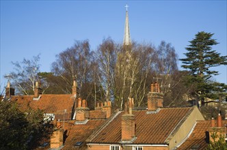 Pan-tiled roofs and chimneys on traditional housing in Woodbridge, Suffolk, England, United