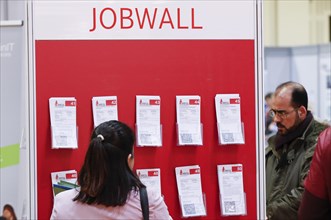 Job offers are posted on a job wall at the job exchange for refugees and foreign citizens in