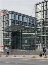 Modern architecture of Berlin Central Station with glass facade, pedestrians and urban environment