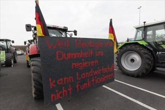 Sign criticising the government on a tractor, farmers' protests, demonstration against policies of