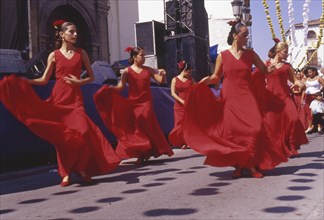 Group of flamenco dancers at street party in Velez-Malaga, Andalusia, Spain, Southern Europe.