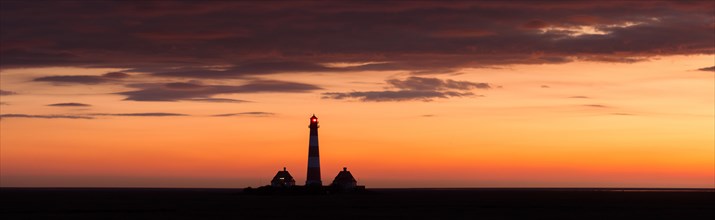 Lighthouse Westerheversand at sunset in summer, Westerhever, Wadden Sea National Park, North