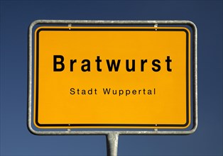 Bratwurst town sign, location of the Bergisch town of Wuppertal, North Rhine-Westphalia, Germany,