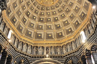 The dome of the cathedral with starry sky and black and white striped marble columns and round
