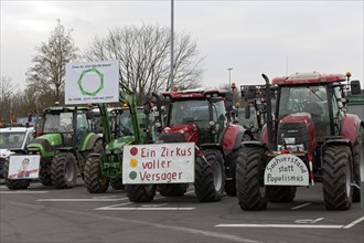 Farmer protests, tractors with signs, demonstration against policies of the traffic light