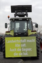 Tractor with poster on agriculture, farmers' protests, demonstration against the policy of the