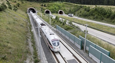Two tunnels for cars on the A71 motorway, next to a tunnel with an ICE1 T train. The new Leipzig