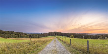 A path with a view of the Weserbergland, landscape, nature photograph, sunset, evening mood,