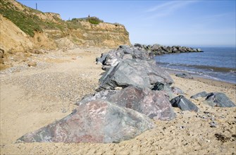 Rock armour used to defend soft crumbling cliffs, Happisburgh, Norfolk, England, United Kingdom,