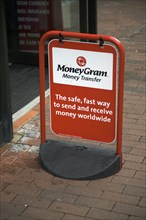 MoneyGram money transfer street advert outside shop