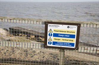 Notice about coastal defence structure at East Lane, Bawdsey, Suffolk, England, United Kingdom,