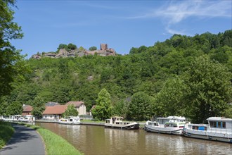 View of the ruins of Luetzelburg and houseboats on the Rhine-Marne Canal, Lutzelbourg, Lorraine,