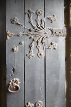 Ornate metalwork hinges on the door to the Percy family chapel, Tynemouth priory, Northumberland,