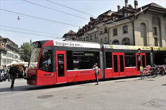 Modern tram in the old town of Bern, Switzerland, Europe