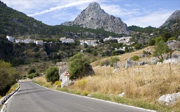 Limestone mountain peaks tower over the Village of Grazalema, Cadiz province, Spain, Europe