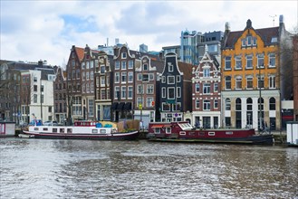 Typical row of houses with canal houses on the Amstel canal, centre, urban, facade, history, city