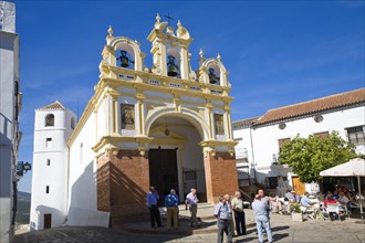 People gather by the baroque church of San Juan at Zahara de la Sierra, Spain Sunday 13 October