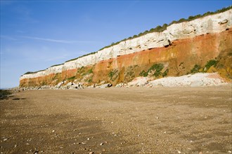 Chalk, red chalk and carstone form striped cliffs of white, red and orange at Hunstanton, Norfolk,