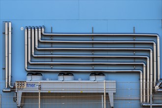 Steel pipework on a blue facade, Bavaria, Allgaeu, Germany, Europe