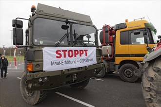 Banners against toll increase and CO2 tax on a truck, farmers' protests, demonstration against