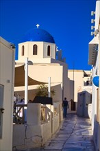 White church with blue dome in Oia, Santorini, Cyclades, Greece, Europe