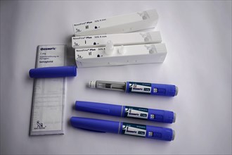 Ozempic injection pens next to open needle packs, for diabetes 2 patients, Stuttgart,