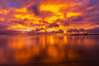 Beautiful sunset over ocean water taken from a beach in Guam