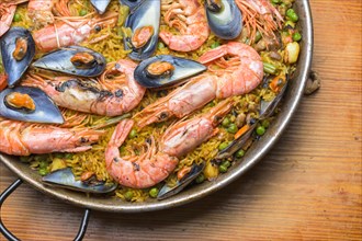 Seafood paella with prawns and shellfish, a feast for the senses, typical Spanish cuisine, Majorca,