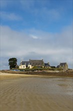 Houses and granite rocks on the beach, Plougrescant, Cote de Granit Rose, Cotes d'Armor, Brittany,