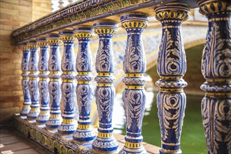 Close up of spanish tiles called azulejos on handrail at Plaza de Espana, Seville, Spain, Europe
