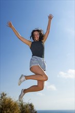 Happy young woman on summer holiday, jump, jumping, jumping, young, glad, happy, luck, joy,
