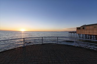 Sunset at the pleasure pier, Royal Pier, Cardigan Bay, Aberystwyth, Ceredigion, Wales, Great