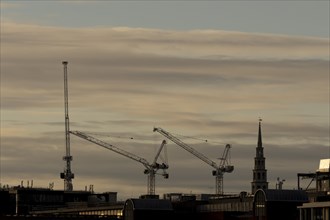 Industrial cranes across the skyline, City of London, England, United Kingdom, Europe