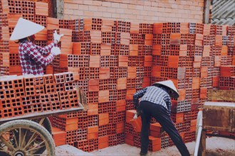 Workers in the traditional brick-making village along the banks of the Co Chien River in Vinh Long