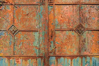 Old metallic surface with weathered rusty texture in blue-green and orange tones, Mettmann, North
