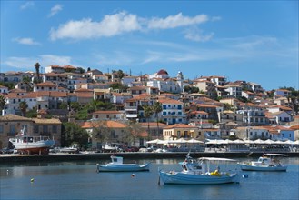 A picturesque coastal town on a sunny day with boats in the water, Koroni, Pylos-Nestor, Messinia,