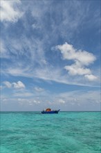 Little boat in the turquoise waters of Agatti Island, Lakshadweep archipelago, Union territory of