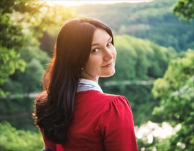 Young woman smiling and looking over her shoulder into nature, AI generated, AI generated