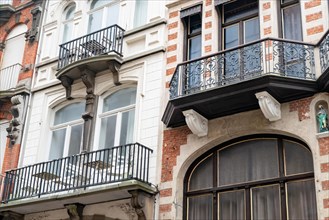 Detail of an ornate building with balconies and stucco elements, Blankenberge, Flanders, Belgium,