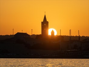 Sunset, silhouette of the church towers of Rab, town of Rab, island of Rab, Kvarner Gulf Bay,