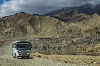 Local bus on unpaved road, Kingdom of Mustang, Nepal, Asia
