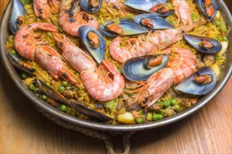Brightly colored seafood paella presented in a traditional pan, typical Spanish cuisine, Majorca,