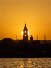 Golden evening light at sunset, silhouette of the church towers of Rab, town of Rab, island of Rab,