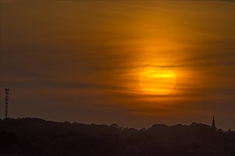 Evening sun veiled by clouds, Schoenberg, Mecklenburg-Vorpommern, Germany, Europe