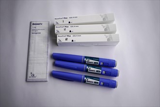Ozempic injection pens and needle packs spread out, for diabetes 2 patients, Stuttgart,
